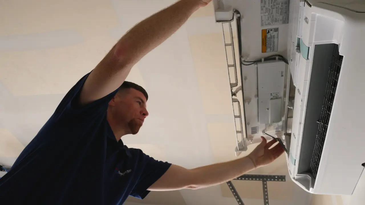 Advanced Air technician installing a ductless mini-split head — one option for zoning Steiner Ranch's multi-story lake-ridge homes