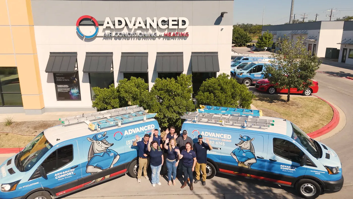 Advanced Air Conditioning + Heating team and fleet outside their Cedar Park headquarters